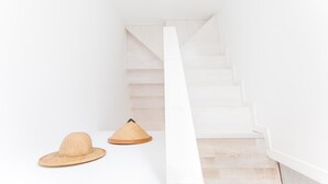 A white staircase in a minimalist interior. - 9 Balinese-style Houses with 3 Bedrooms, Communal Pool, and Jacuzzi (Roses)