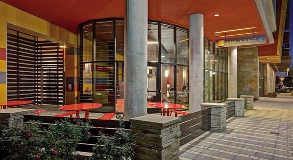Guests can dine or socialize in this outdoor space with a semi-circular seating area.