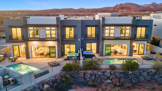 A modern multi-story house with a swimming pool, outdoor seating, and a mountain backdrop. - Ace on the 8th: 2 Private Pools, Sleeps 58! (Washington)