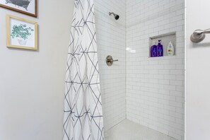 Bathtub, hair dryer, towels, soap