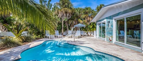 A heated pool, pool loungers