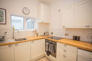 Cottage, salle de bains privée, vue ville | Cuisine partagée