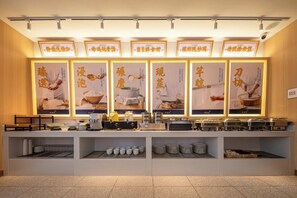 A buffet setup with multiple food stations, illuminated signage, and a clean, organized layout. - Junlin Banshan Hotel (Chenzhou)
