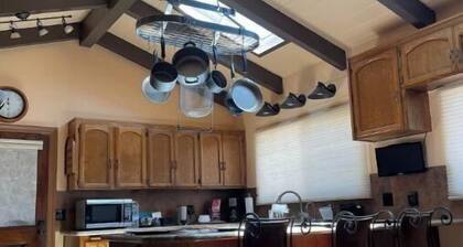 20 people can stay. Peaceful 1 acre of Avocado ranch. 2 stories. 16 beds.