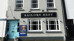 A building with a sign reading "Sailors Rest" above the entrance. - Sailors Rest (Bideford)