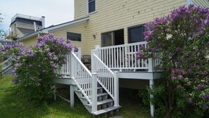 A residential building with a two-story deck and a staircase leading to the entrance. - Short Sands View - Spacious Beach Home, Sleeps 18, Easy Walk to Short Sands Beach (York)
