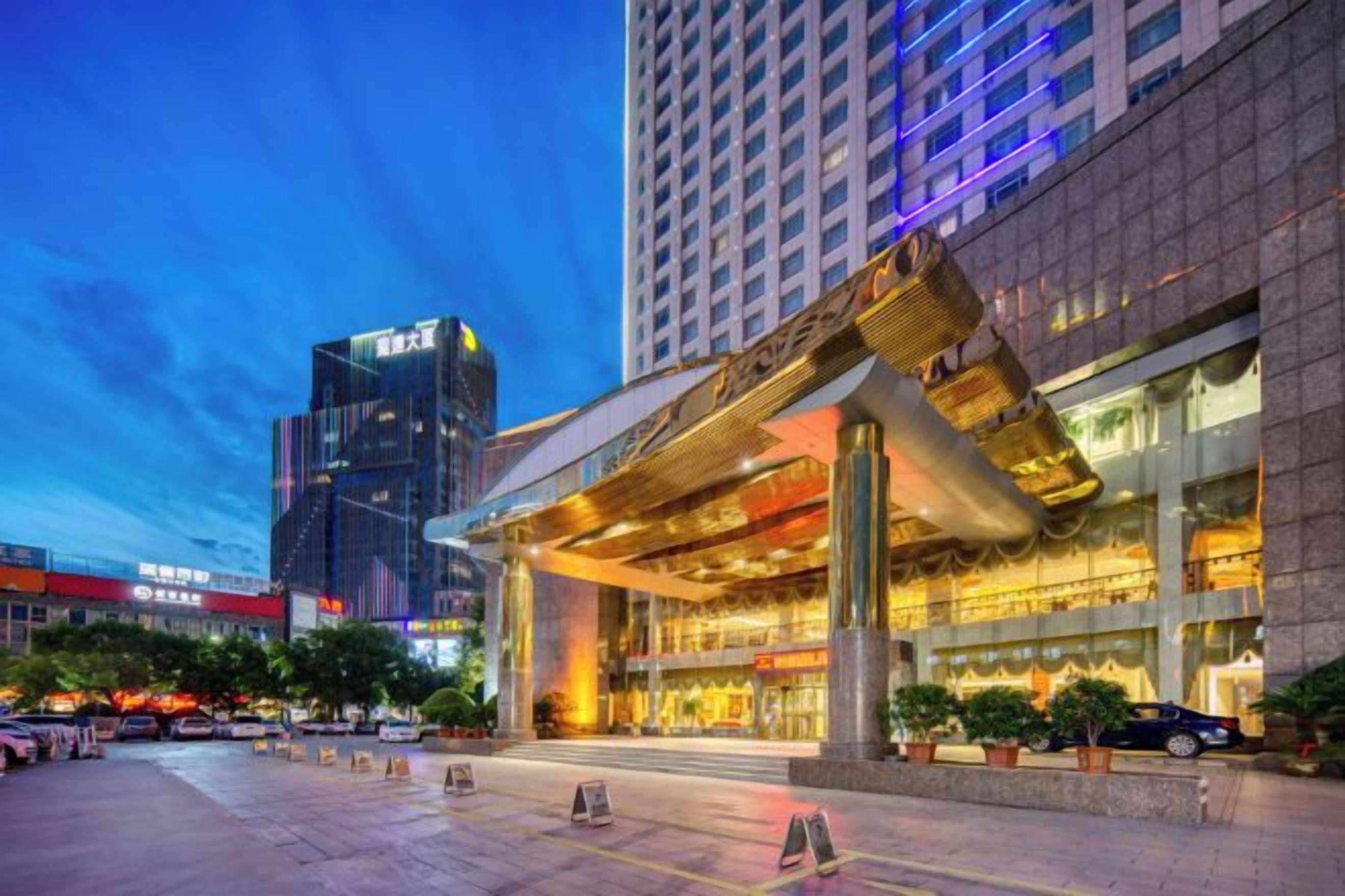 A modern hotel with a prominent entrance and a large vertical structure.