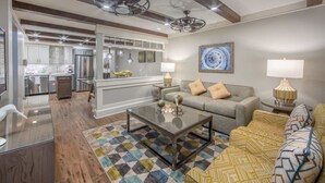 A spacious living room with a sofa, a coffee table, and a patterned rug. - Two Bedroom Lock-off, Luxury Condo, Cape Canaveral, Florida (2563804) (Cape Canaveral)