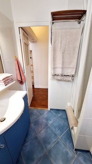 Shower, hair dryer, towels, toilet paper