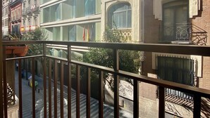 A multi-story building with large windows and balconies. - Charming Gran Vía V - in the City Center (Madrid)
