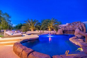 A heated pool, sun loungers