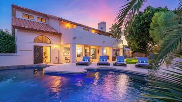 A heated pool, pool loungers