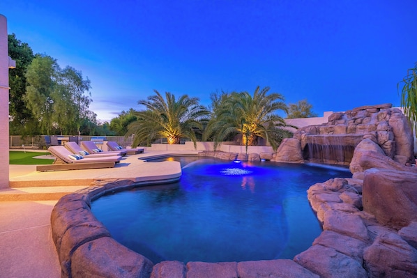 A heated pool, pool loungers