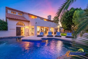A heated pool, sun loungers