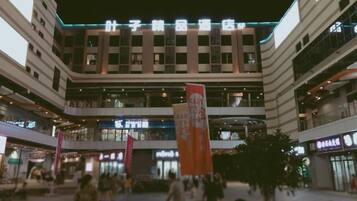 A multi-level shopping mall with various stores and a central open area.