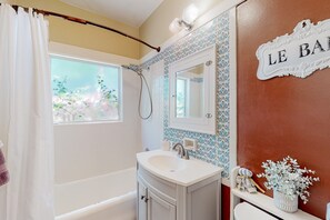 Shower, hair dryer, towels, shampoo