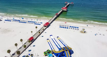 4-Bed Coastal Retreat: Heated Pool, 200 Steps to Beach, Walk to Fun!