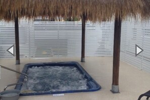 Relax in a hot tub surrounded by serene views.