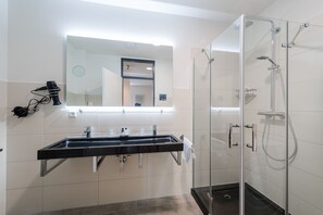 Shower, hair dryer, towels, soap