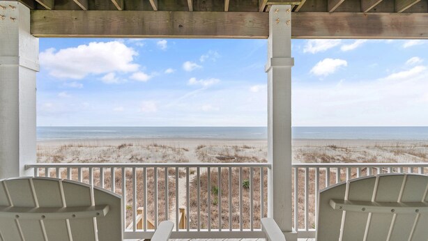 A wooden deck with two white chairs facing a beach view. - "Mocean Granted" - Oceanfront Home, 5 Bedrooms / 4 Bathrooms (Holden Beach)
