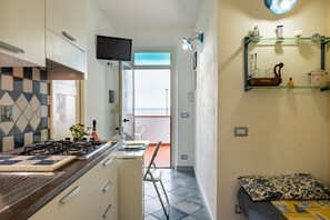 Fridge, coffee/tea maker, cookware/dishes/utensils, dining tables - Casa Sisine (Cala Gonone)