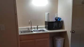 Fridge, microwave, coffee/tea maker, cookware/dishes/utensils