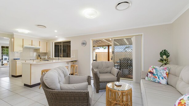 A modern living space with a kitchen, dining area, and seating area. - Sea Renity - Coastal Hideaway (Bonny Hills)