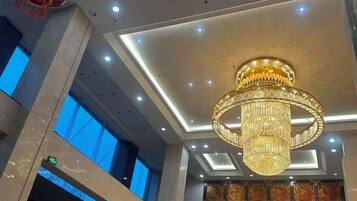 A chandelier with a circular design and multiple tiers.