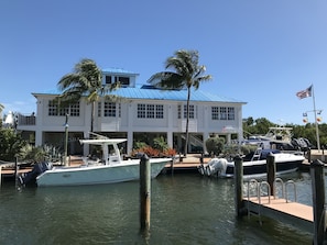 Enjoy waterfront views and access to a dock with a moored boat.