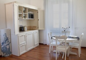 Deluxe Apartment | Living area | 24-inch flat-screen TV with digital channels, TV - The Best Rent-Apartment near Colosseo (Rome)