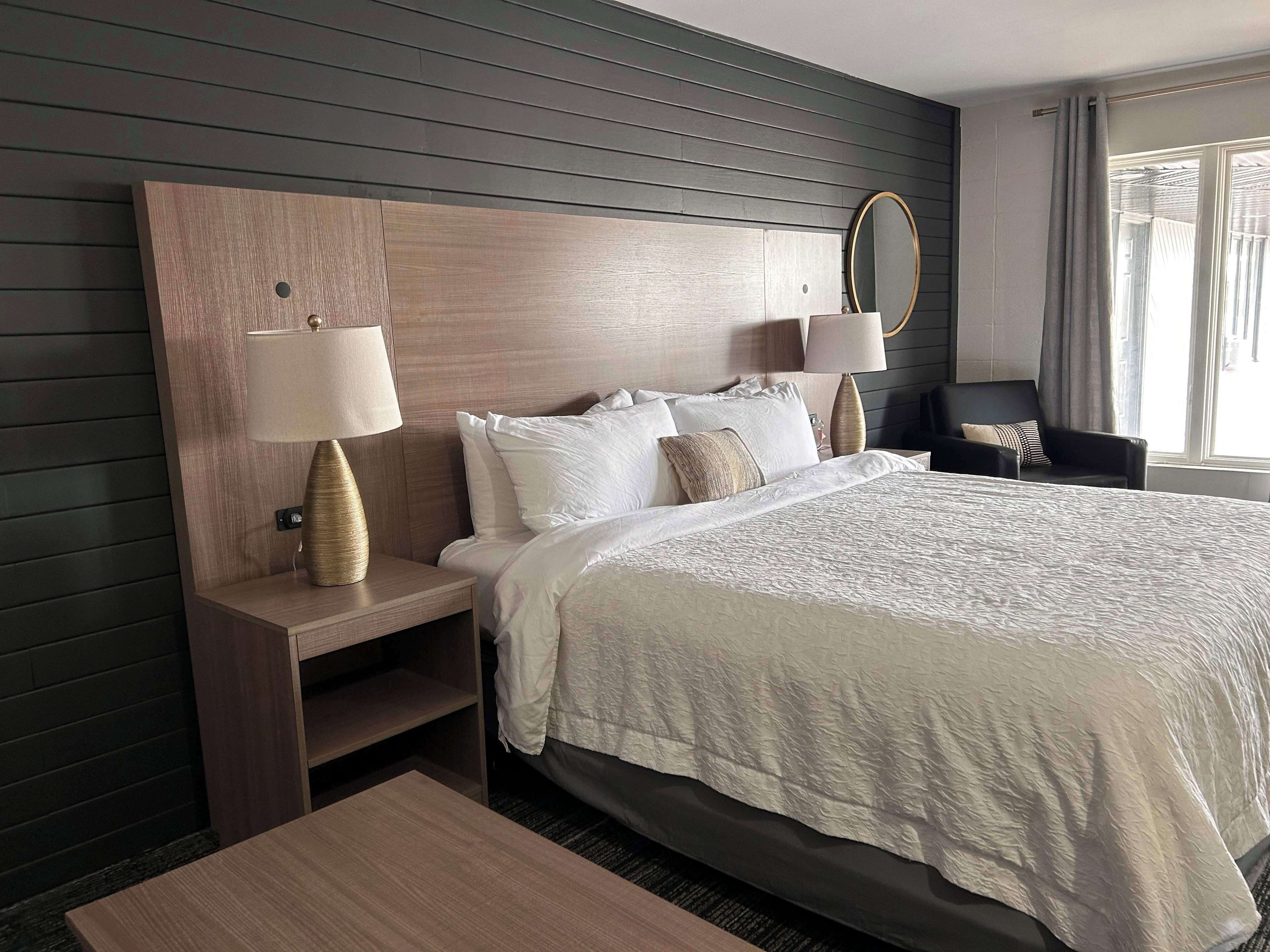 desk, laptop workspace, blackout curtains, iron/ironing board