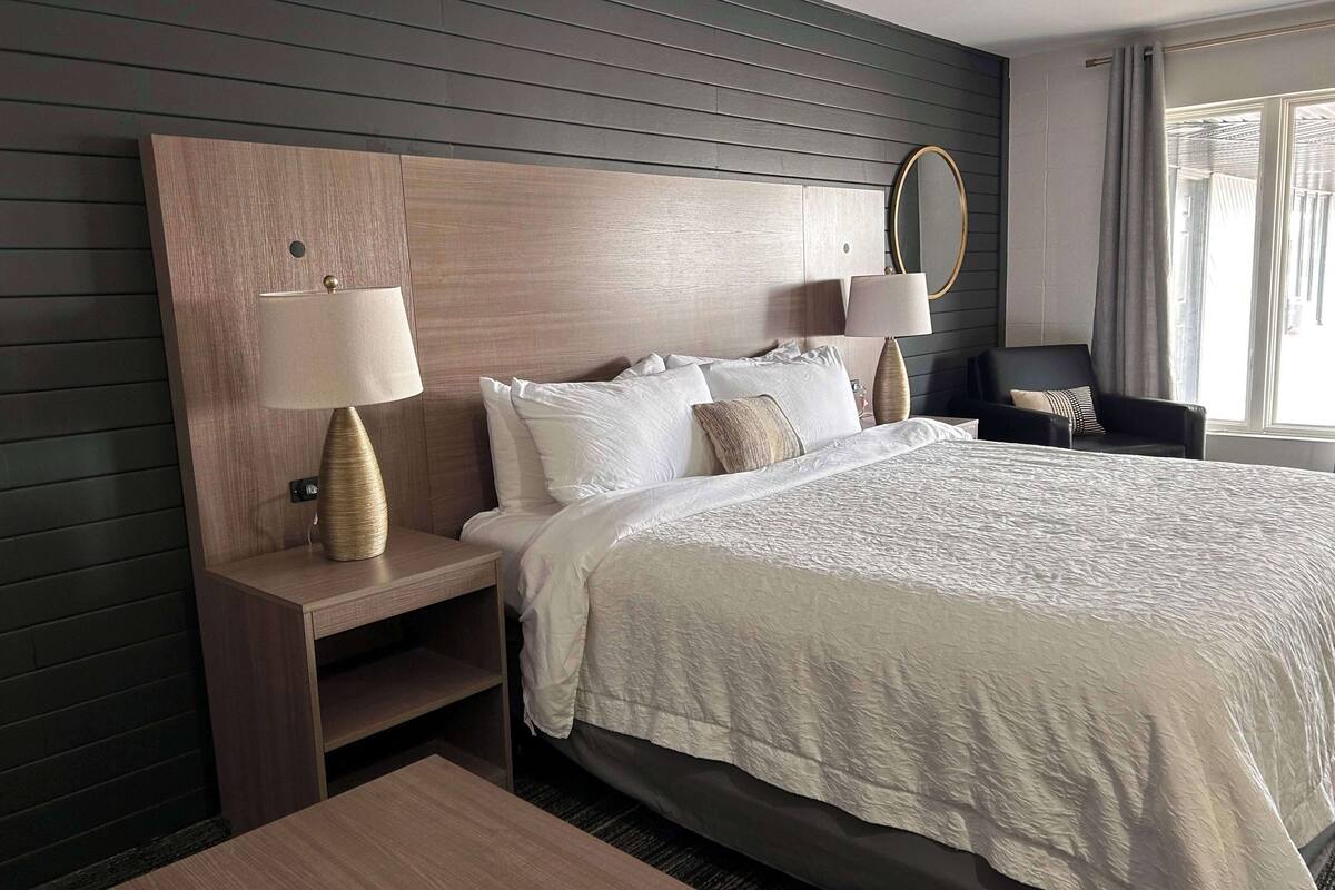 desk, laptop workspace, blackout curtains, iron/ironing board