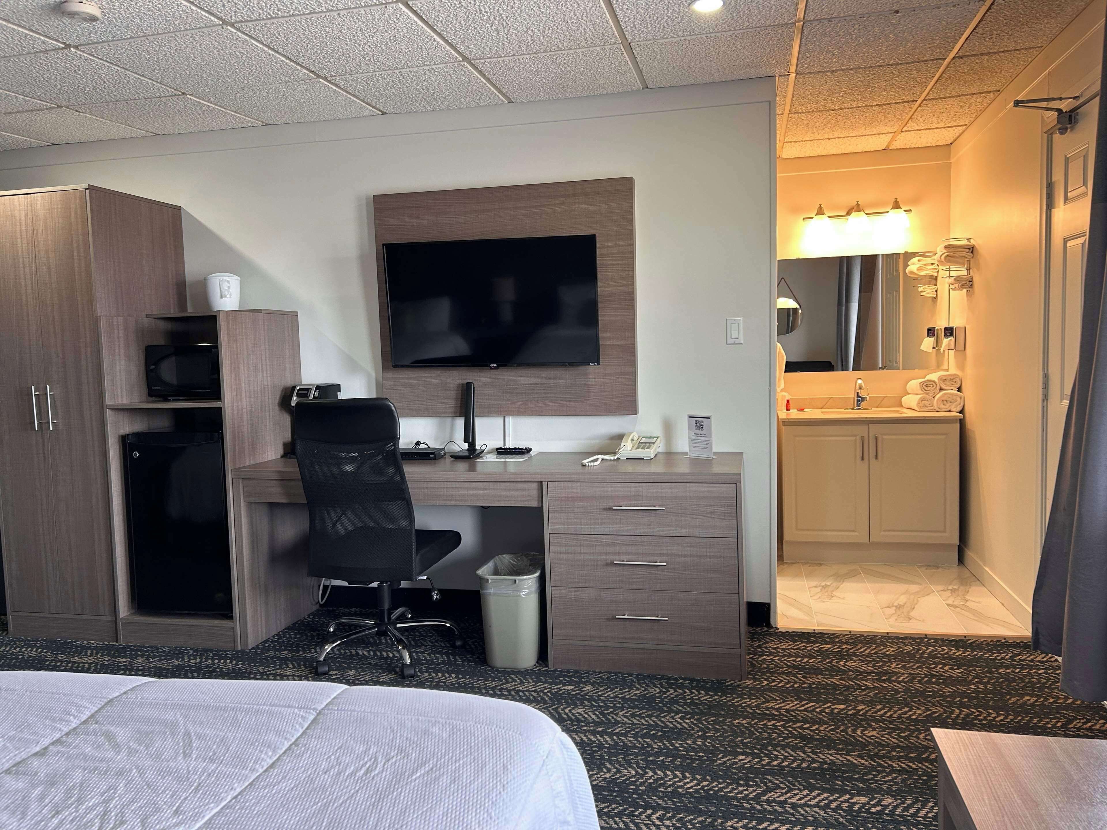 desk, laptop workspace, blackout curtains, iron/ironing board