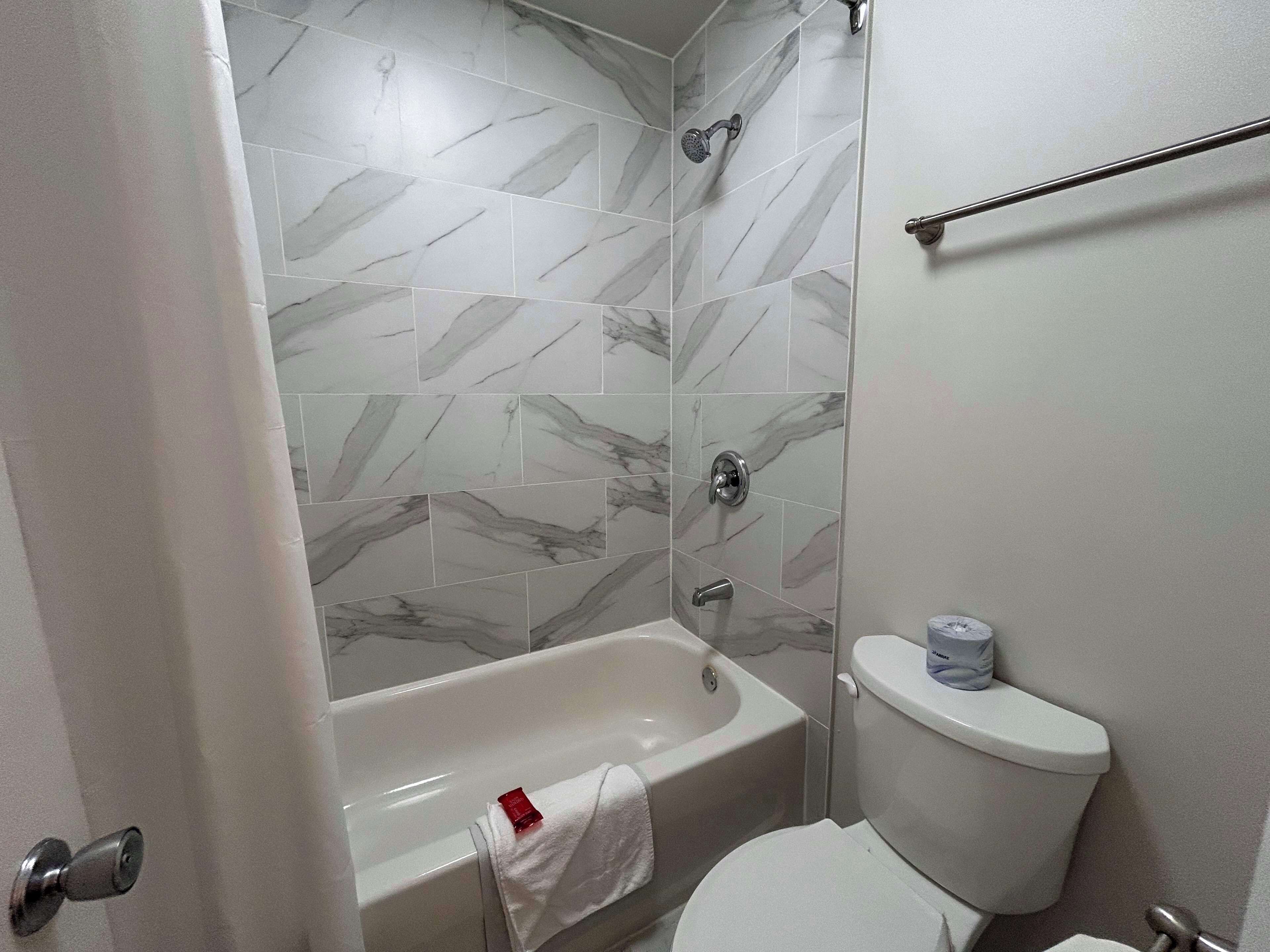 combined shower/bathtub, free toiletries, hair dryer, towels