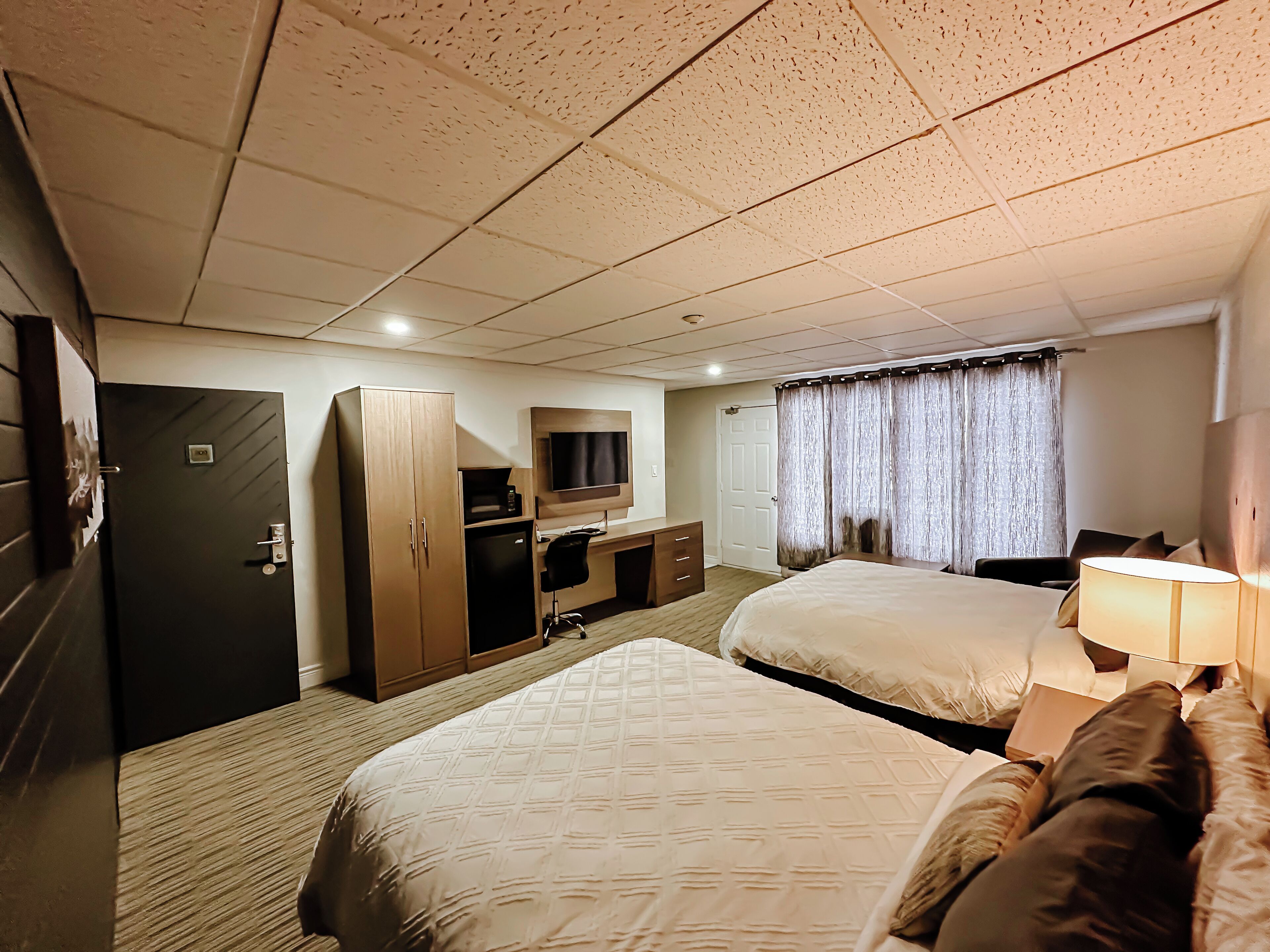 standard room, 2 queen beds, non smoking, refrigerator & microwave | desk, laptop workspace, blackout curtains, iron/ironing board