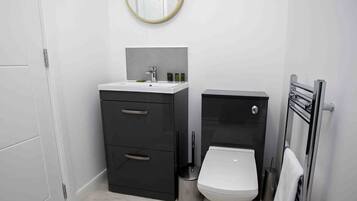 Shower, hair dryer, towels, shampoo