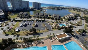 A resort with multiple swimming pools, a marina, and beachfront hotels. - Modern Gulf-View Reno! Steps to Pool, Easy walk to Beach + Beach Gear & Wagon (Miramar Beach, Destin)