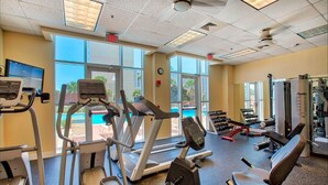 A gym with treadmills, elliptical machines, and weight equipment. - Modern Gulf-View Reno! Steps to Pool, Easy walk to Beach + Beach Gear & Wagon (Miramar Beach, Destin)