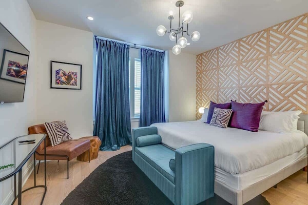 Unwind in a spacious king bed, complete with a TV for your entertainment.