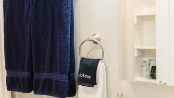 Combined shower/bathtub, hair dryer, towels, soap