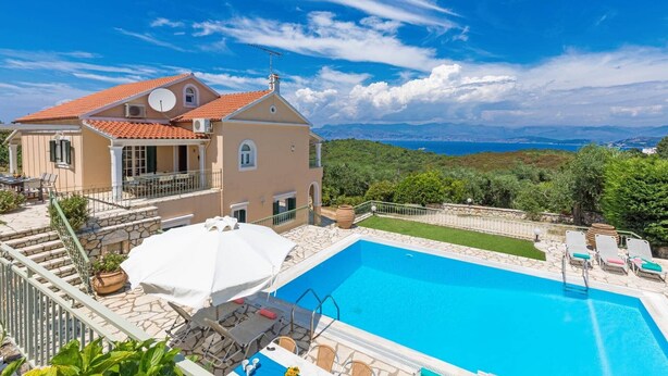 A two-story house with a swimming pool, outdoor furniture, and a scenic view of the sea and mountains. - Villa Ftelias by Villa Plus (Άγιος Στέφανος)