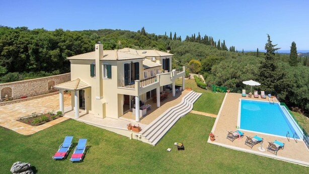 A two-story house with a swimming pool, outdoor seating, and a view of the sea. - Villa Gina by Villa Plus (Ionian Islands)