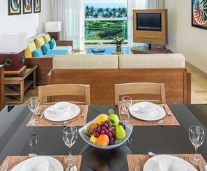 Enjoy a meal at the dining table for four, with a view of the lush landscape outside.