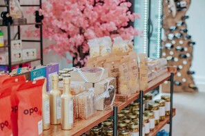 A display of packaged goods on shelves with a cherry blossom tree in the background. - 2BR + 2BA Lake Chatuge Cabin w/ Mountain Views! (Hiawassee)