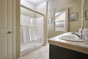 Combined shower/tub, hair dryer, towels, soap