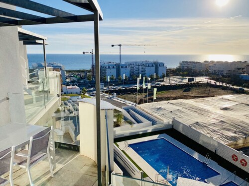 Newly built, at the top with large terraces and sea views