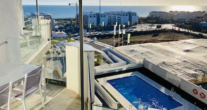 Newly built, at the top with large terraces and sea views