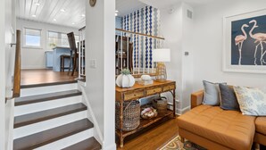 A staircase leading to a dining area with a view of the outdoors.