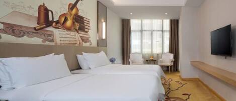 A hotel room with two beds, a television, a desk, and a window with curtains.