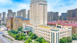 A multi-story building with a prominent entrance and a flat roof. - Ruixiang International Hotel (Quanjiao)